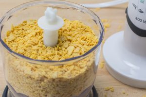 crushing cornflakes for crispy baked portobello strips